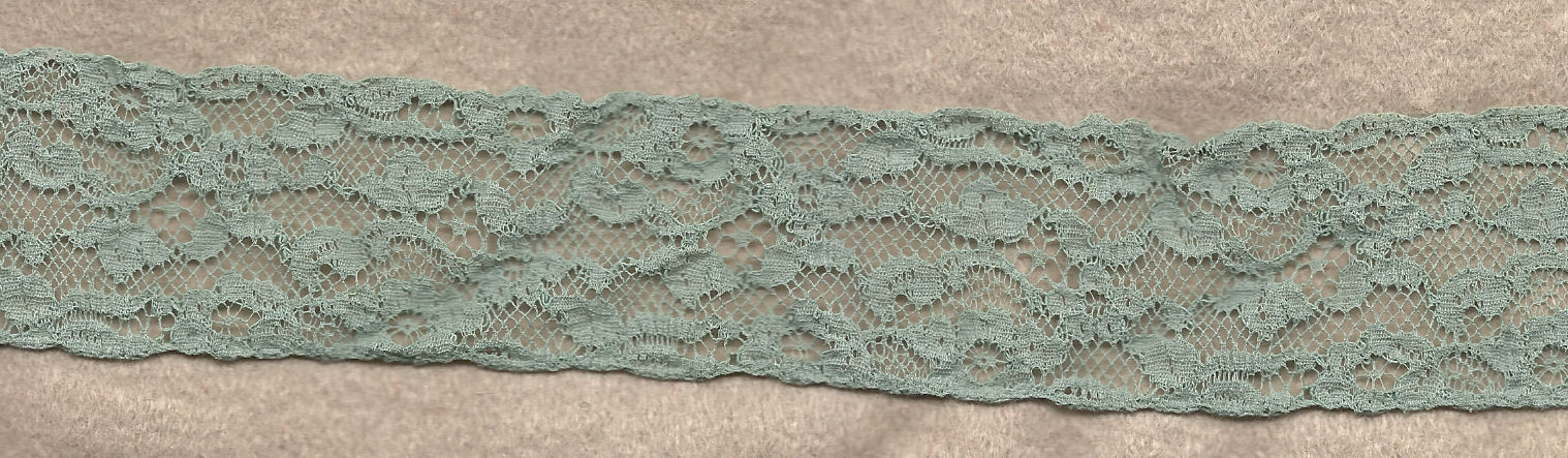 Flowery machine lace with gimp on one side