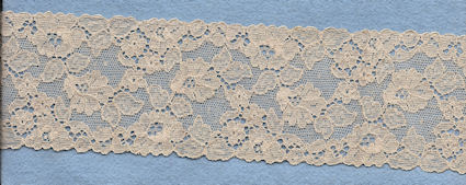Flowery machine lace with gimp on one side