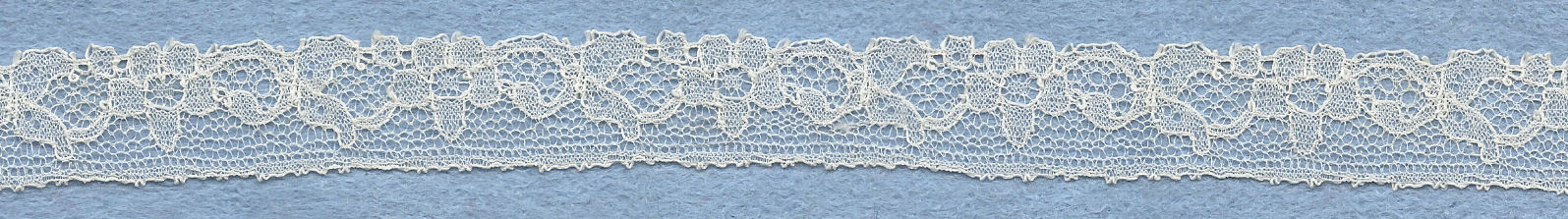 Flowery machine lace with gimp on one side